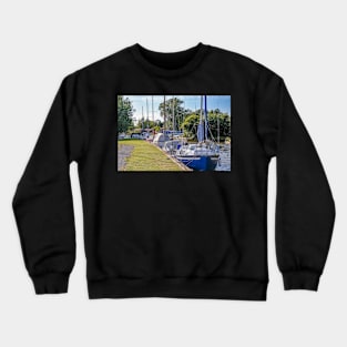 Sailing boats moored in Hickling, Norfolk Broads Crewneck Sweatshirt